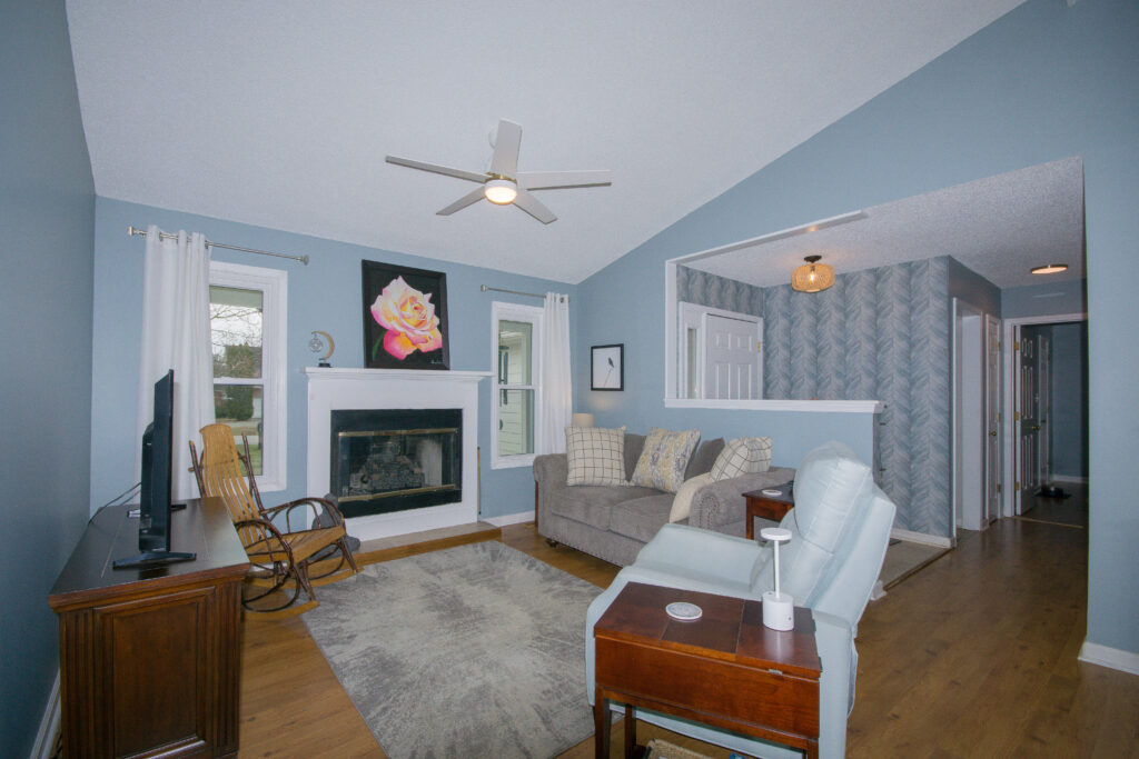Family Room, Fresh interior blue paint, modern fixtures, vaulted ceilings, Madison home listed by John Wesley BRooks