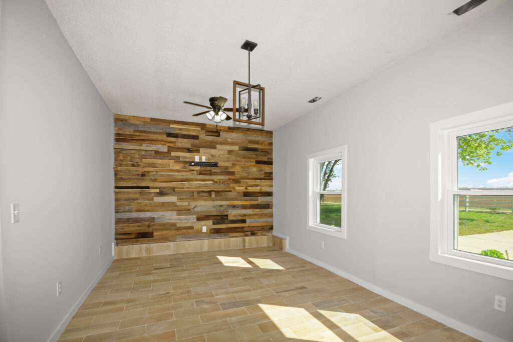 bonus room, shiplap, wood wall, wood floors, gray walls, home for sale with modern light fixtures, realtor John Wesley Brooks