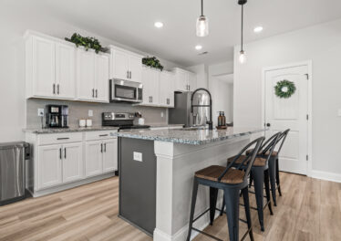 Home For Sale, Aerial Views, Custom Home, Modern design, kitchen and family room, full brick home listed by John Wesley Brooks
