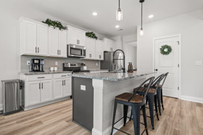 Home For Sale, Aerial Views, Custom Home, Modern design, kitchen and family room, full brick home listed by John Wesley Brooks