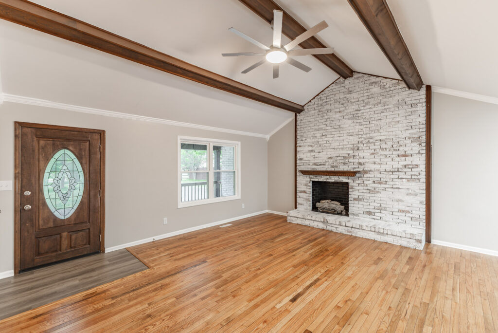 Tall ceilings, fireplace, brick exposed wall, wood floors, all new paint, renovated home in Athens, listed by John Wesley Brooks