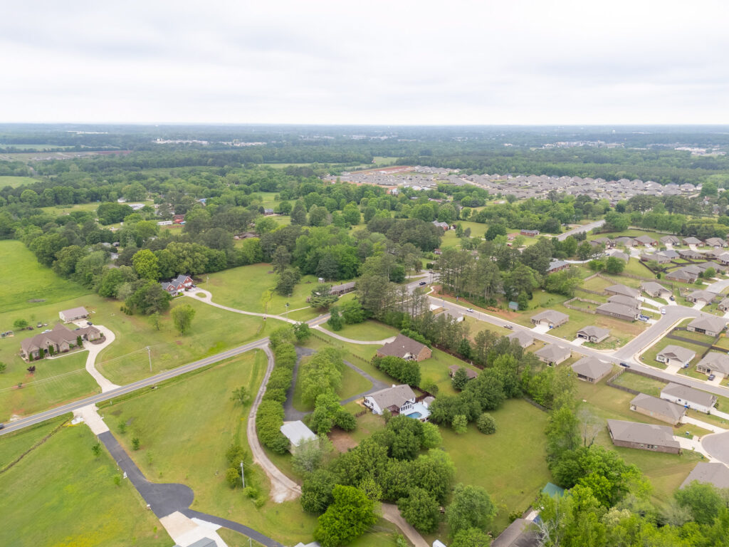 Aerial View Of A renovated home for sale with swimming pool, large acre lot, property listed by John Wesley Brooks