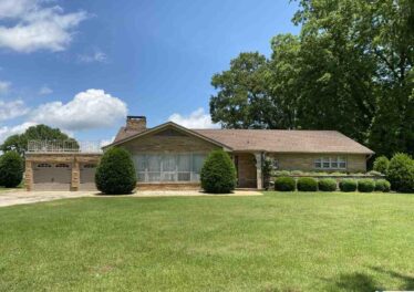 Commercial property for sale, home for sale, exterior photo, full brick home, listed by John Wesley Brooks