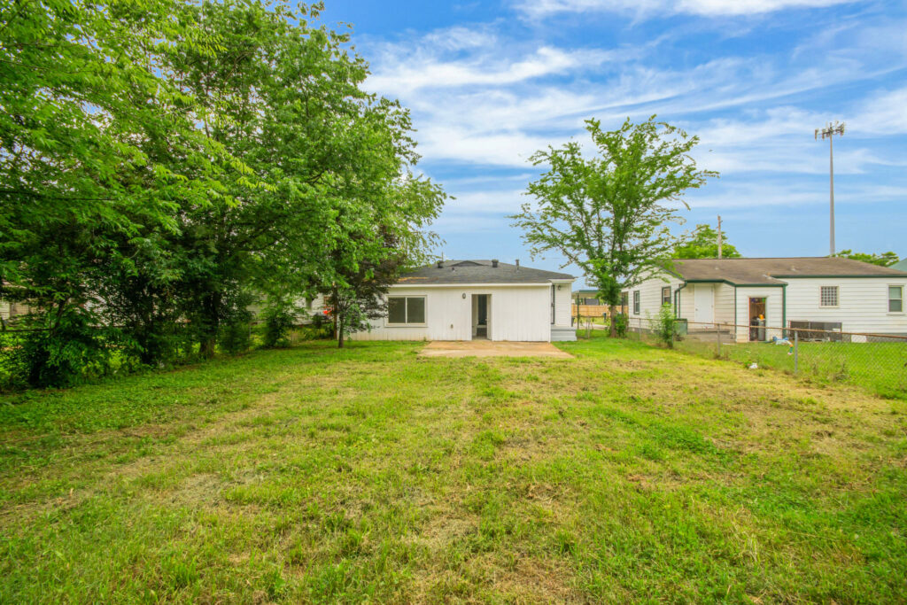 Backyard, Treed lot, centrally located renovated home for sale by John Wesley Brooks in Huntsville Alabama