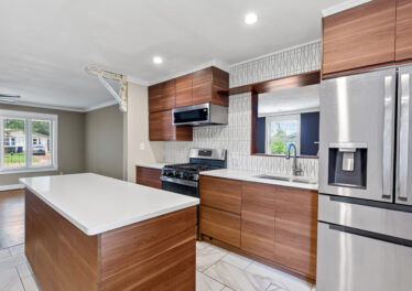 Renovated kitchen, Mid century design, stainless steel appliances. Home listed by John Wesley Brooks in Huntsville Alabama