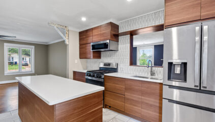 Renovated kitchen, Mid century design, stainless steel appliances. Home listed by John Wesley Brooks in Huntsville Alabama