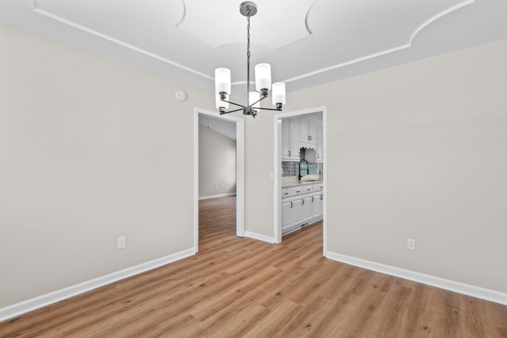 Dining Room, New Lvp flooring, new paint, new lighting, home for sale by John Wesley brooks in Huntsville Alabama