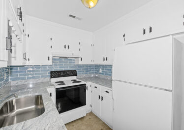 Kitchen view, updated kitchen, white cabinets, subway tile backsplash, new lights, white appliances, condo for sale, huntsville alabama, John Wesley Brooks