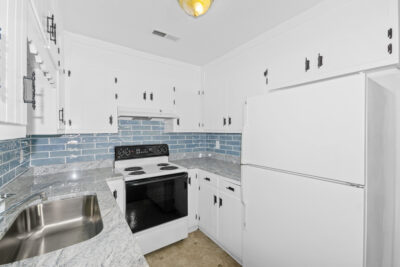Kitchen view, updated kitchen, white cabinets, subway tile backsplash, new lights, white appliances, condo for sale, huntsville alabama, John Wesley Brooks