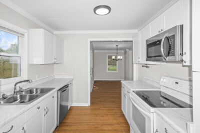 Kitchen, white cabinets, new updated fixtures, lvp flooring, best deal in huntsville, Realtor John Wesley Brooks