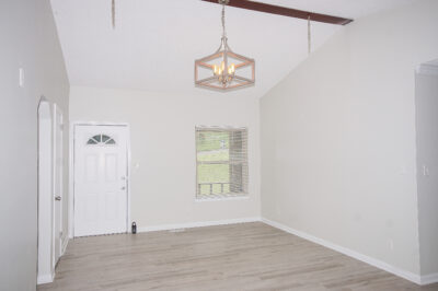 Renovated, gray walls, lvp flooring, tall vaulted ceilings, upgraded lights, Huntsville Alabama home for sale by best realtor John Wesley Brooks