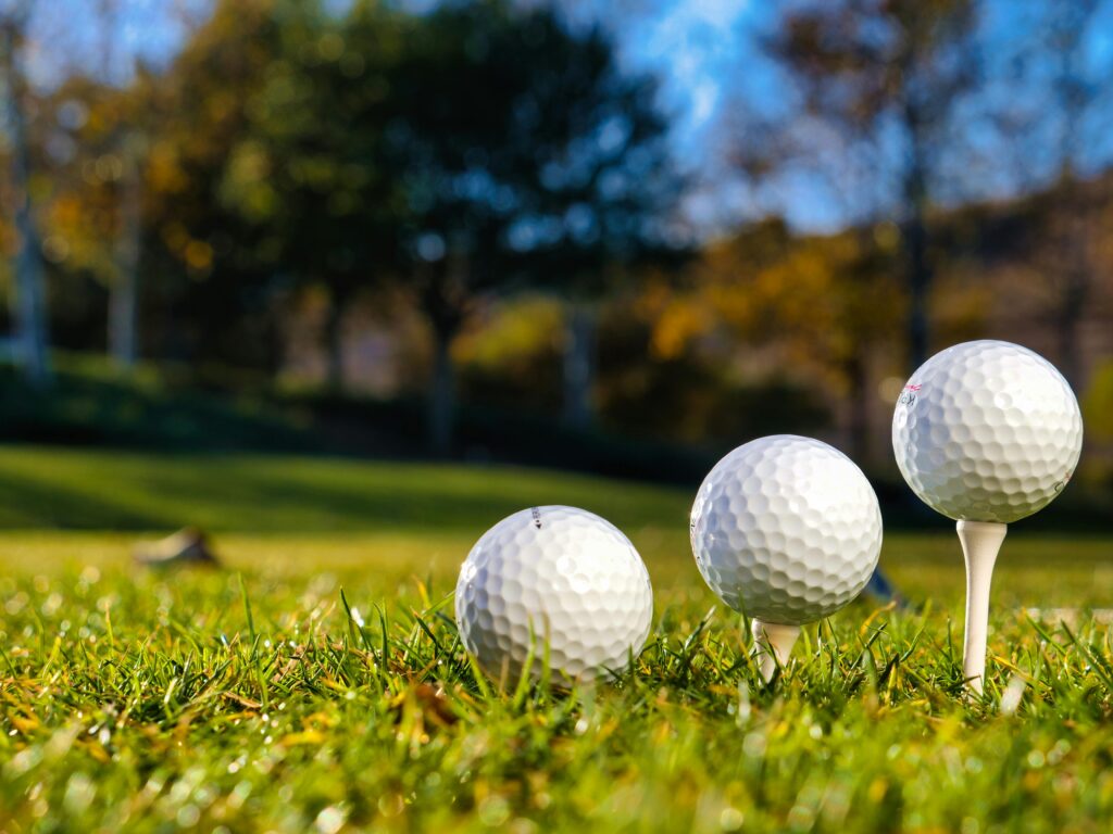 Which Neighborhoods in Athens or Huntsville Are Closest to Golf Courses?
