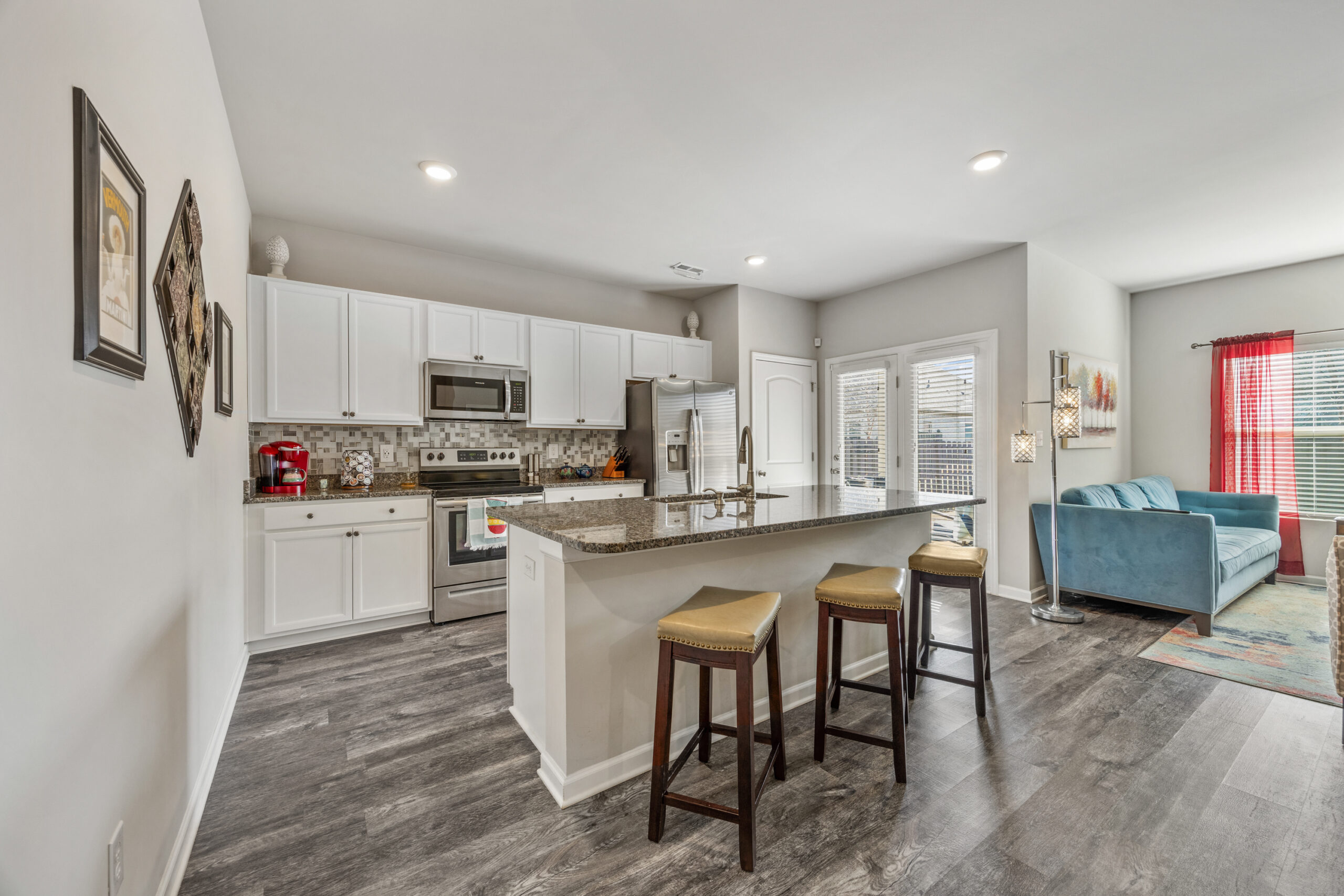 Kitchen with island, open floor plan, lvp flooring, gray walls, property for sale, Home in Meridianville Alabama, listed by John Wesley Brooks