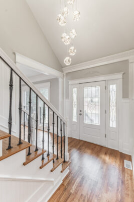 Entrance, Big door, grey walls, tall vaulted ceiling, updated modern light, wood floors, property listed by John Wesley Brooks