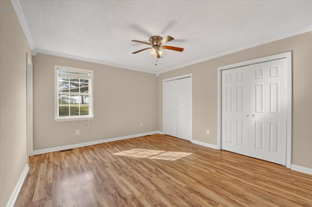 Bedroom, wood flooring, light walls, ceiling fan, new painted home for sale, madison alabama home, listed by top realtor John Wesley Brooks