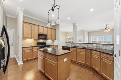 Kitchen with island, granite, hardwood floors, open floor plan, home for sale in Meridianville Alabama, Listed by the best Huntsville alabama Realtor John Wesley Brooks