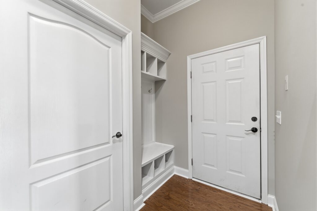 Mud room, built in, cabinets, white doors and cabinets, wood floors, grey walls