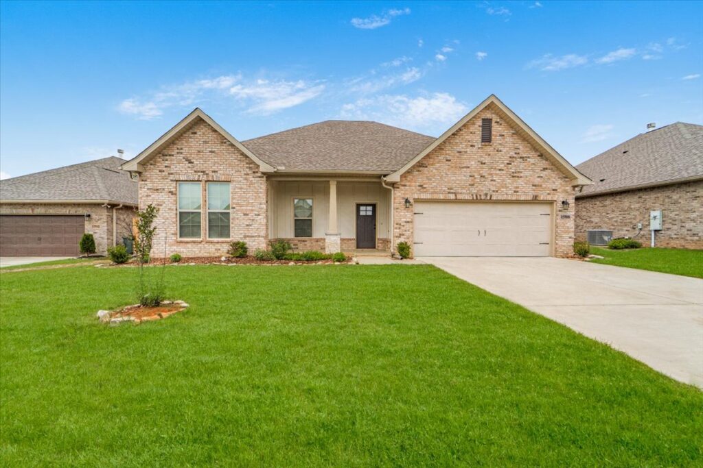 Front photo of a full brick home for sale at 15908 Big Bed Drive in Harvest Alabama, new home, less than a year old, open floor pan, upgraded home listed by the best Realtor in Madison Alabama John Wesley Brooks