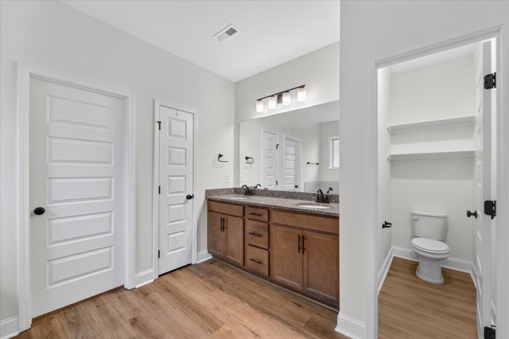 Master bathroom, modern upgrades, LVP flooring, modern lights, Move in ready new home, Listing by the best realtor in Huntsville Alabama John Wesley Brooks