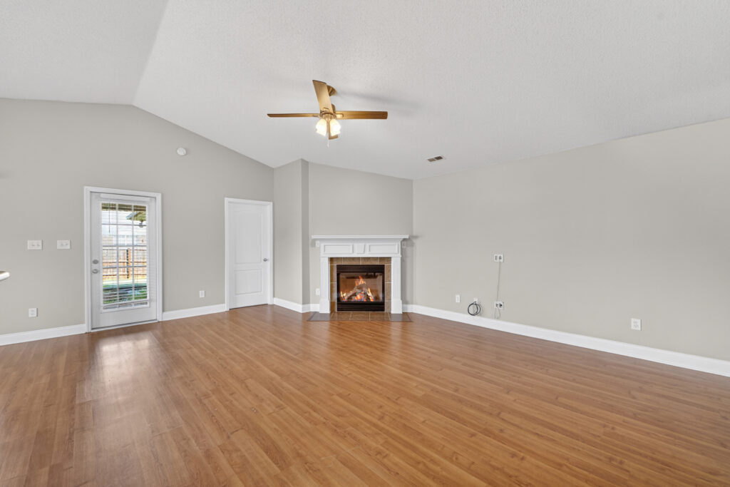 Family Room, wood floors, grey walls, ceiling fan, fireplace view, Large home, Madison Alabama home for sale, Best Realtor in Madison Alabama, John Wesley Brooks