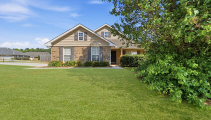 Full brick home in Madison Alabama, Front yard, green grass, blue skies
