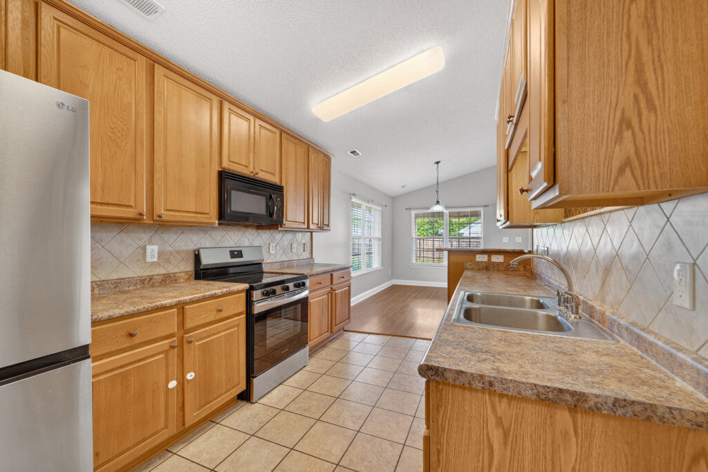 Kitchen, tile floors, stainless steel appliances, smooth ceilings, Madison Alabama home for sale, 188 Amsterdam Place, Listed by John Wesley Brooks, The Best Realtor in Madison and Huntsville Alabama