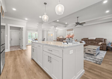 Custom designed and move in ready home, kitchen island, wood floors, smooth ceilings, grey walls, open floor plan, modern lights, Toney Alabama home for sale, Listed by The Best Realtor in Huntsville, John Wesley Brooks top Realtor in Huntsville