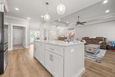 Custom designed and move in ready home, kitchen island, wood floors, smooth ceilings, grey walls, open floor plan, modern lights, Toney Alabama home for sale, Listed by The Best Realtor in Huntsville, John Wesley Brooks top Realtor in Huntsville