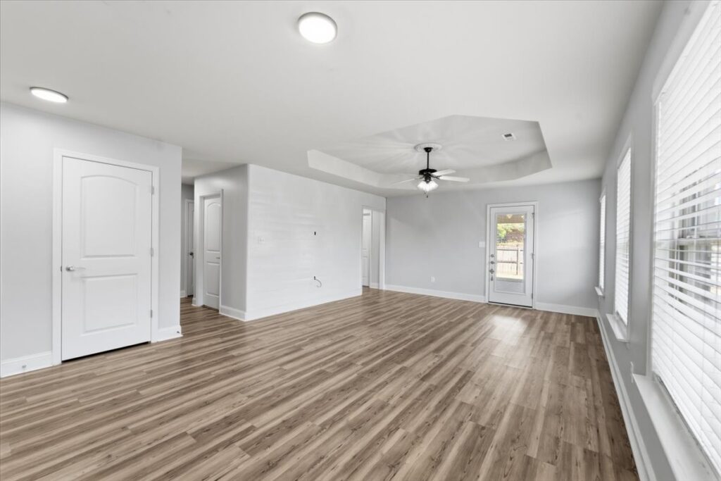 Master bedroom, grey walls, lvp floors, smooth ceilings, listed by the best real estate agent in Huntsville Alabama John Wesley Brooks