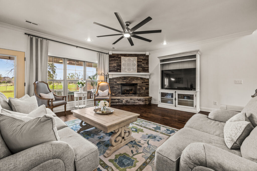 Family Room, Fireplace, ceiling fan, recess can light, wood floors, home for sale in Meridianville by John Wesley Brooks, Best Realtor in Huntsville Alabama 