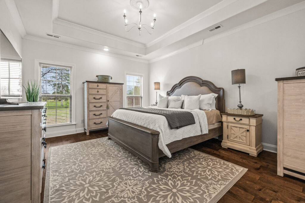 Master bedroom, wood floors, tall trey ceiling, farm house design, listed by Top Huntsville's Realtor John Wesley Brooks