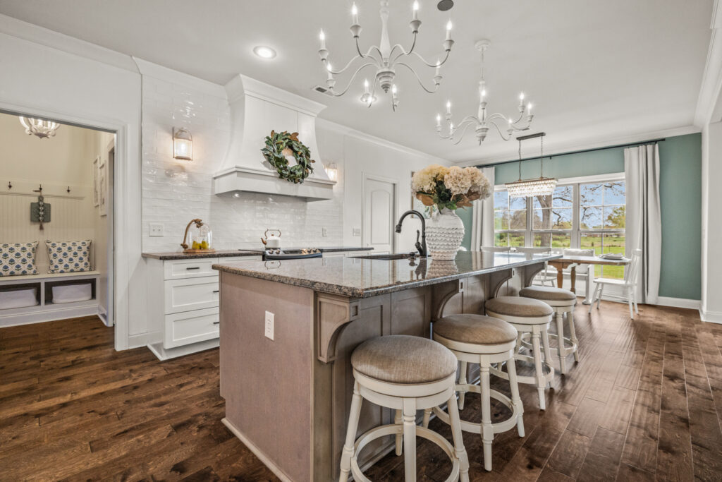 Dream kitchen, Kitchen island, two tone cabinets, white and brown cabinets, modern design, custom built home, wood floors, farm house kitchen, home for sale in Meridianville alabama by Top Huntsville Realtor John Wesley Brooks, custom home for ssale