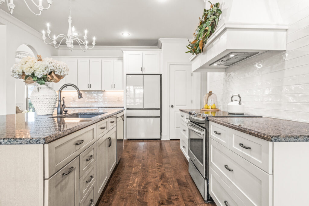 Dream custom designed kitchen, Island, White Cabinets, wood floors, kitchen hood, farm house design, stainless steel appliances, upgraded plumbing and light fixtures, Modern Design, HGTV inspired home, Meridianville Alabama home for sale, Listed by Huntsville's best Realtor John Wesley Brooks