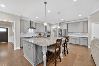 Upgraded move in ready home for sale in Meridianville Alabama, Modern Kitchen design, kitchen island, grey cabinets, stainless steel appliances, Home listed by Huntsville's best realtor John Wesley Brooks