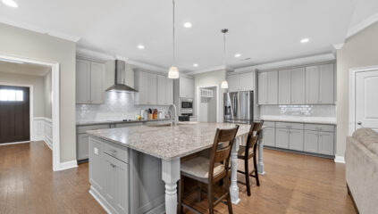 Upgraded move in ready home for sale in Meridianville Alabama, Modern Kitchen design, kitchen island, grey cabinets, stainless steel appliances, Home listed by Huntsville's best realtor John Wesley Brooks