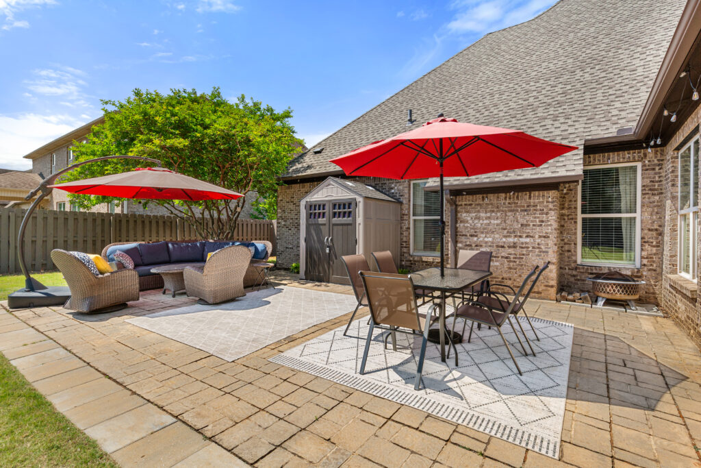 Dream Back yard, pavers, sitting area, back porch design, stones, entertaining spot, Home for sale in Huntsville Alabama B The Best Realtor in Madison John Wesley Brooks
