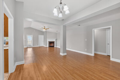 Madison home for sale, renovated, wood floors, grey walls, updated light fixtures, fireplace, large living room, listed by john Wesley Brooks