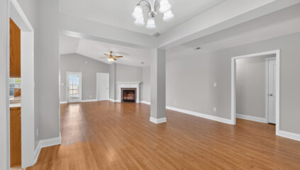 Madison home for sale, renovated, wood floors, grey walls, updated light fixtures, fireplace, large living room, listed by john Wesley Brooks